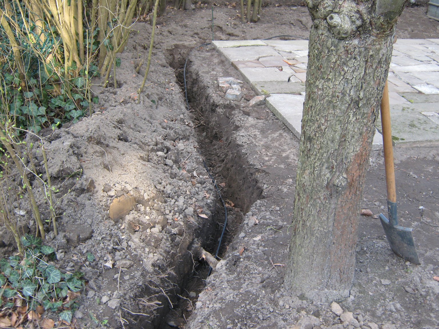 The base for the garden house and a partly-dug trench