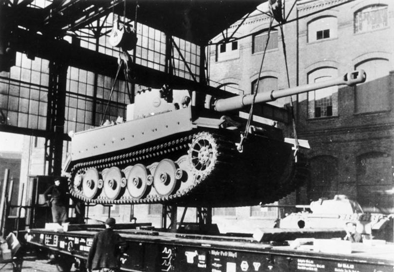 A Tiger I is loaded onto a special rail car at the Henschel plant